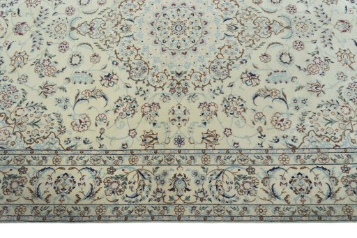 Corner detail of 2000s Nain rug showing border pattern and Wool pile