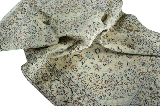 Surface texture of 2000s Nain rug with natural Wool and intricate pattern