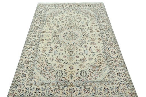 Surface texture of 2000s Nain rug with natural Wool and intricate pattern