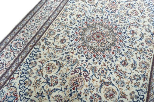 Backside of handmade New Nain rug showing knot structure and weave density