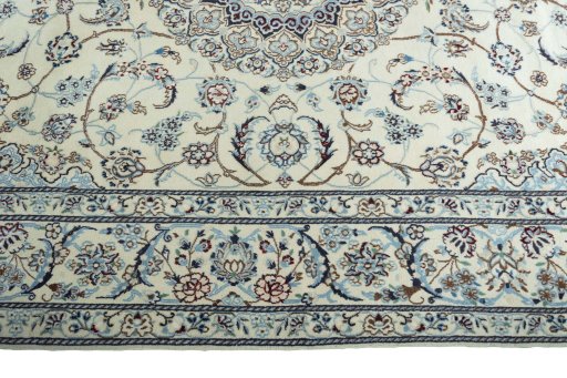 Corner detail of 2000s Nain rug showing border pattern and Wool pile