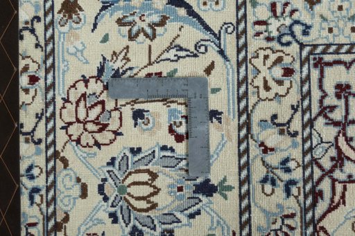 Backside of handmade 2000s Nain rug showing knot structure and weave density