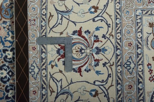 Backside of handmade New Nain rug showing knot structure and weave density