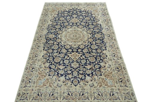 Surface texture of 2000s Nain rug with natural Wool and intricate pattern