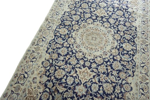 Backside of handmade 2000s Nain rug showing knot structure and weave density