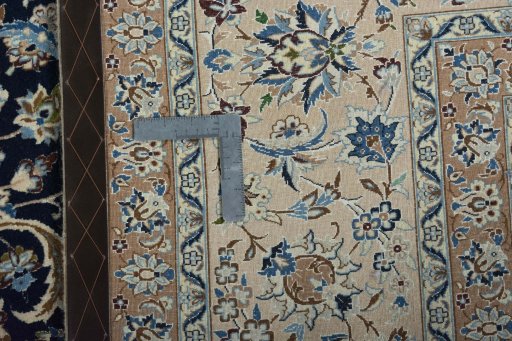 Backside of handmade 1970s Nain rug showing knot structure and weave density