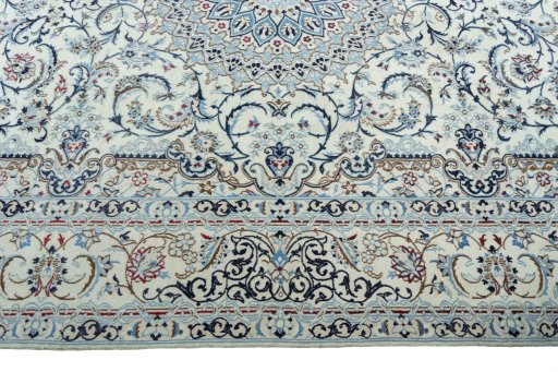 Corner detail of 2000s Nain rug showing border pattern and Wool pile