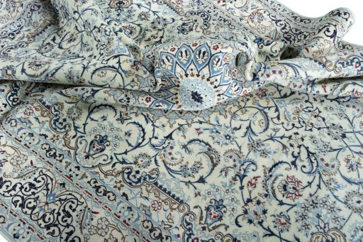 Surface texture of 2000s Nain rug with natural Wool and intricate pattern