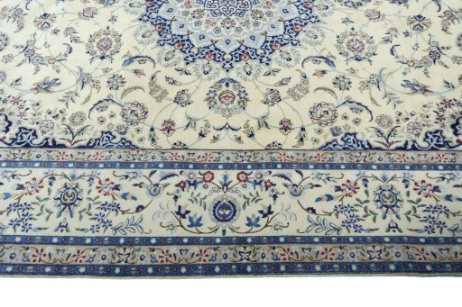 Corner detail of 2000s Nain rug showing border pattern and Cork pile