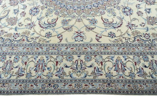 Corner detail of 2000s Nain rug showing border pattern and Wool pile