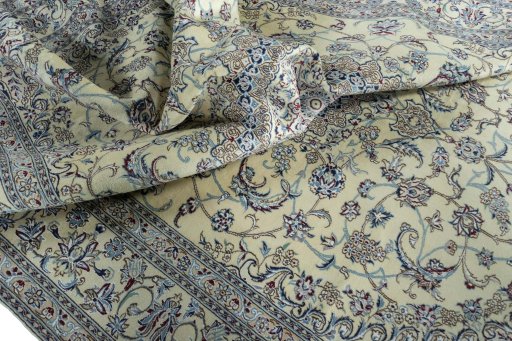 Surface texture of 2000s Nain rug with natural Wool and intricate pattern