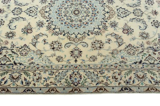 Corner detail of 2000s Nain rug showing border pattern and Wool pile