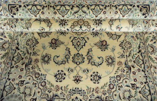 Close-up detail of 2000s Nain rug from Iran / Persia showing Wool weave