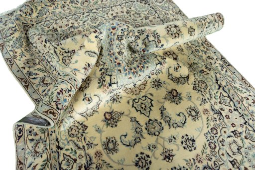 Surface texture of 2000s Nain rug with natural Wool and intricate pattern
