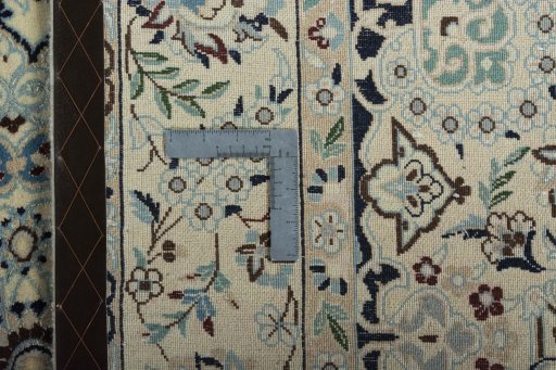 Backside of handmade 2000s Nain rug showing knot structure and weave density