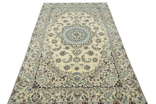 Surface texture of 2000s Nain rug with natural Wool and intricate pattern