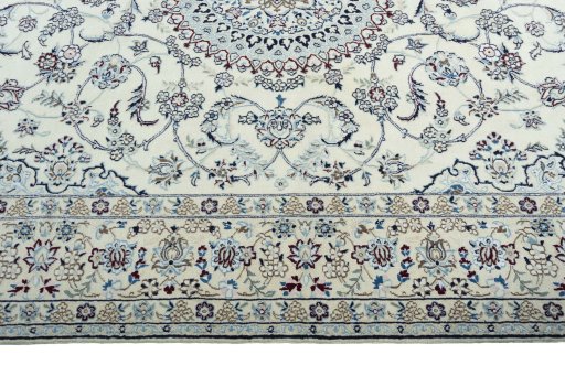 Corner detail of 2000s Nain rug showing border pattern and Wool pile