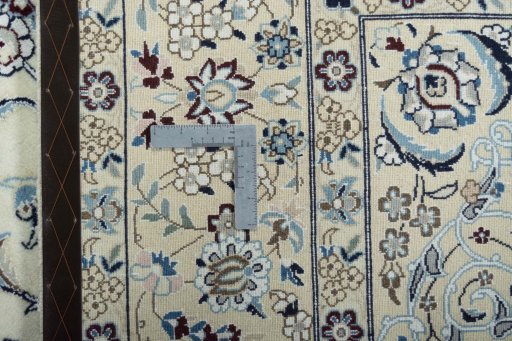 Backside of handmade 2000s Nain rug showing knot structure and weave density