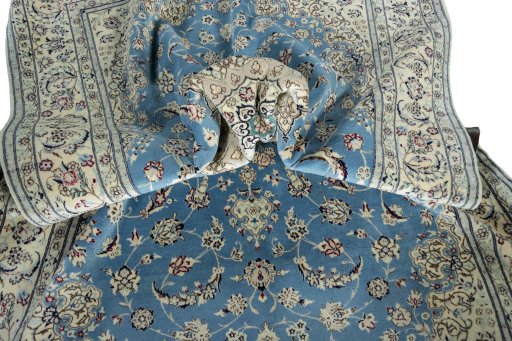 Surface texture of 2000s Nain rug with natural Cork and intricate pattern