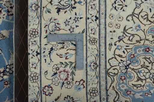 Backside of handmade 2000s Nain rug showing knot structure and weave density