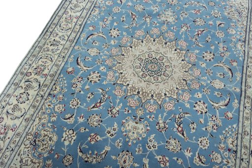 Backside of handmade 2000s Nain rug showing knot structure and weave density