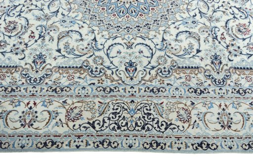 Corner detail of 2000s Nain rug showing border pattern and Wool pile