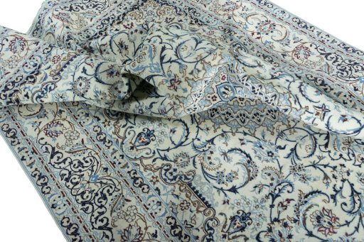 Surface texture of 2000s Nain rug with natural Wool and intricate pattern