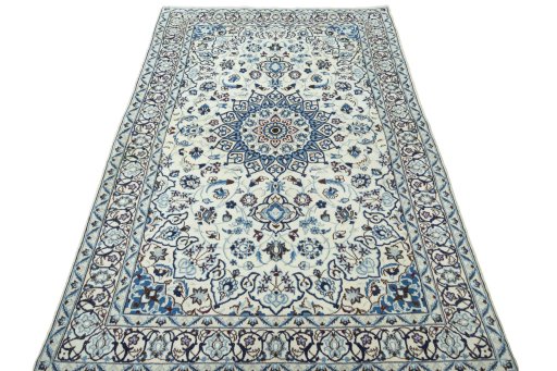 Surface texture of 2000s Nain rug with natural Wool and intricate pattern