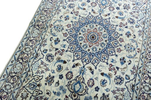 Backside of handmade 2000s Nain rug showing knot structure and weave density