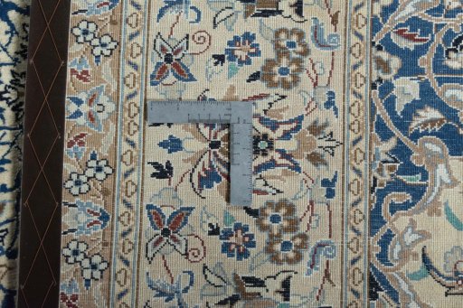 Backside of handmade 2000s Nain rug showing knot structure and weave density