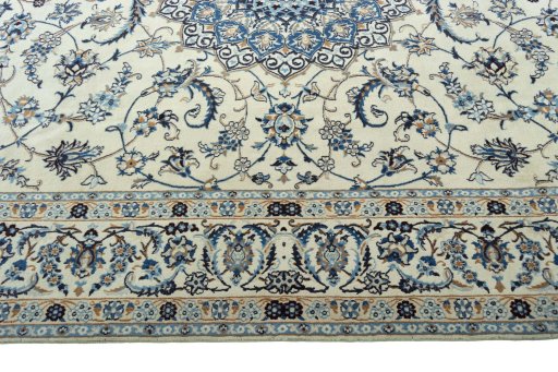 Corner detail of 2000s Nain rug showing border pattern and Wool pile