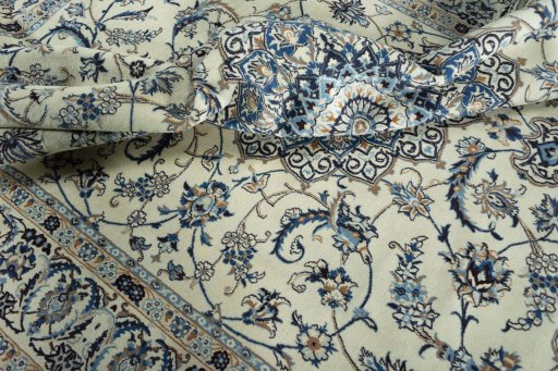 Surface texture of 2000s Nain rug with natural Wool and intricate pattern