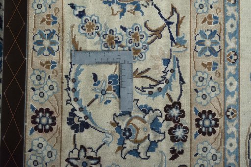Backside of handmade 2000s Nain rug showing knot structure and weave density