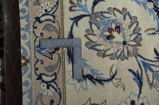 Backside of handmade New Nain rug showing knot structure and weave density