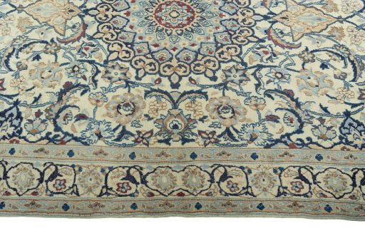 Corner detail of 2000s Nain rug showing border pattern and Wool pile