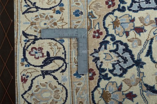 Backside of handmade 2000s Nain rug showing knot structure and weave density