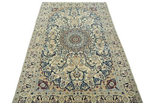 Surface texture of 2000s Nain rug with natural Wool and intricate pattern