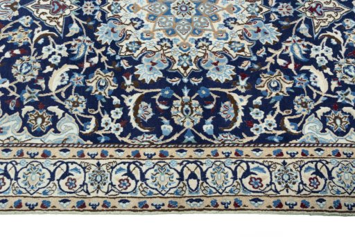 Corner detail of 2000s Nain rug showing border pattern and Wool pile