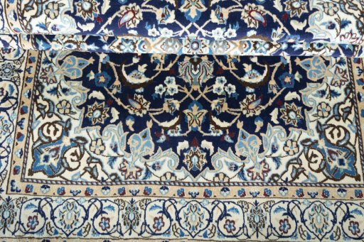 Close-up detail of 2000s Nain rug from Iran / Persia showing Wool weave