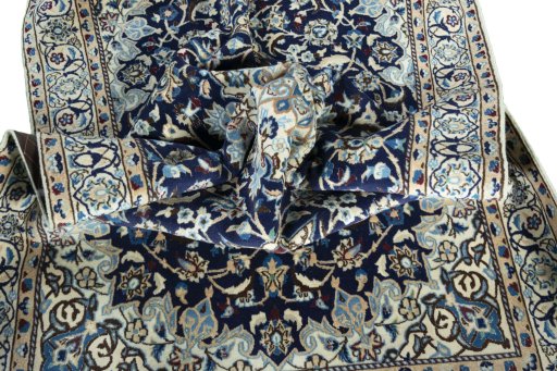 Surface texture of 2000s Nain rug with natural Wool and intricate pattern
