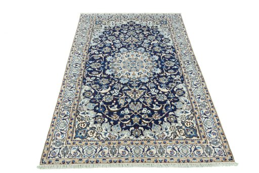 Surface texture of 2000s Nain rug with natural Wool and intricate pattern