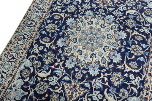 Backside of handmade 2000s Nain rug showing knot structure and weave density