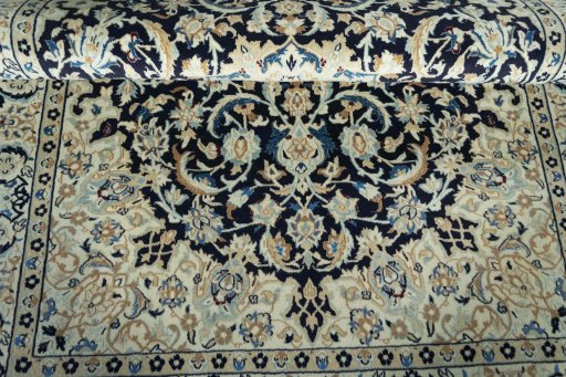 Corner detail of 2000s Nain rug showing border pattern and Wool pile
