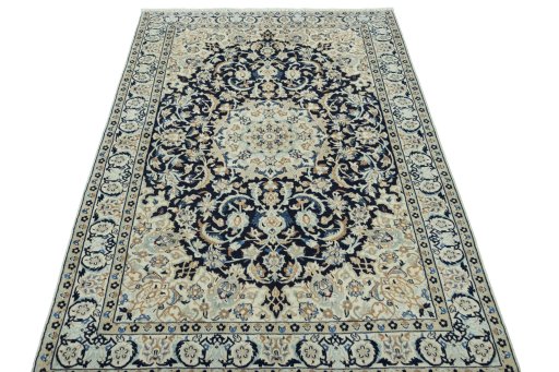 Surface texture of 2000s Nain rug with natural Wool and intricate pattern