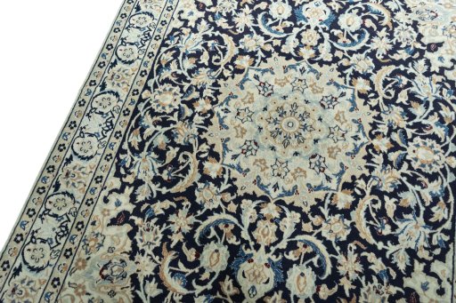 Backside of handmade 2000s Nain rug showing knot structure and weave density