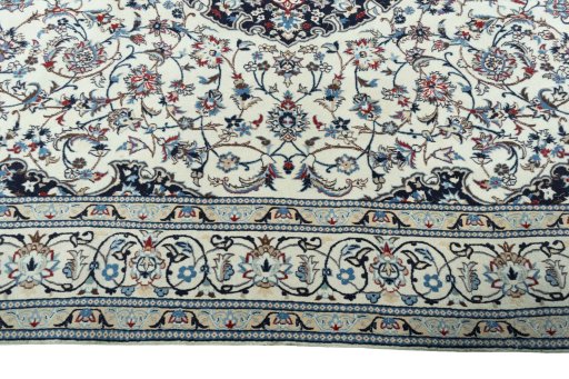 Corner detail of 2000s Nain rug showing border pattern and Wool pile