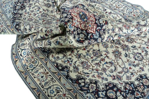 Surface texture of 2000s Nain rug with natural Wool and intricate pattern