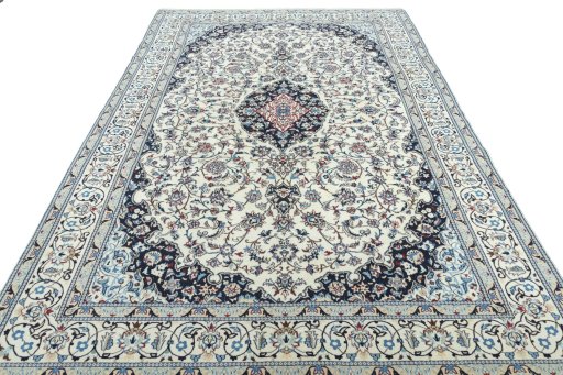 Surface texture of 2000s Nain rug with natural Wool and intricate pattern