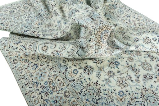 Surface texture of 2000s Nain rug with natural Wool and intricate pattern