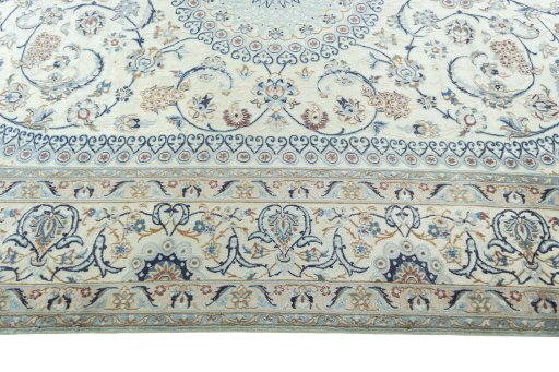 Corner detail of 2000s Nain rug showing border pattern and Wool pile